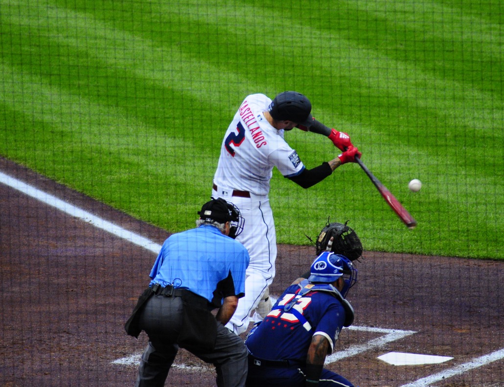 Reds outfielder Nick Castellanos makes contact.