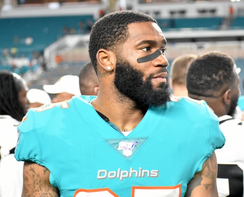 Xavien Howard reported to Miami Dolphins training camp but his contract demands remain unresolved.