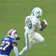 De'Von Achane runs for one of his two touchdowns in the Dolphins' win against the Bills.