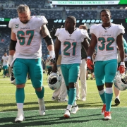 Dolphins trudge off after what may be a season filled with losses. (Tony Capobianco for Five Reasons Sports)