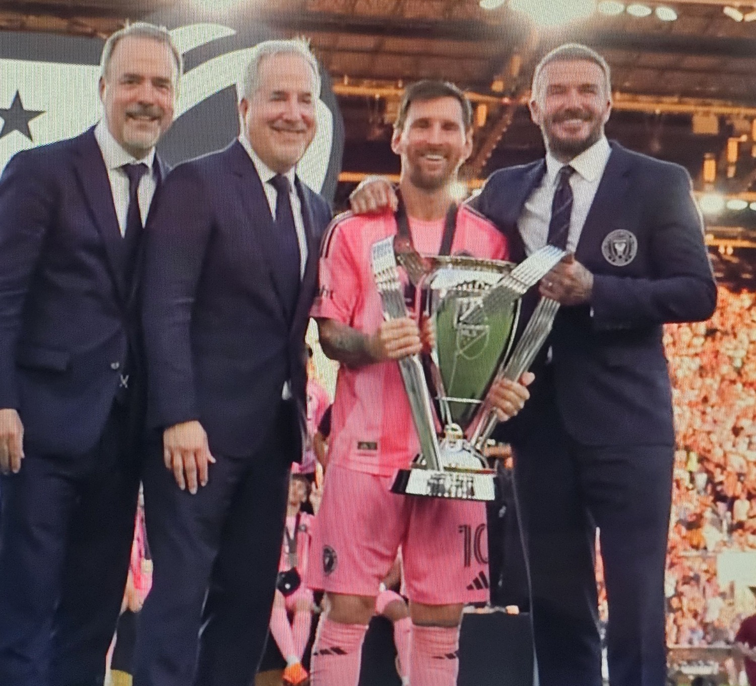 Lionel Messi celebrates Inter Miami's MLS Cup championship with owners David Beckham and Jorge and Jose Mas.