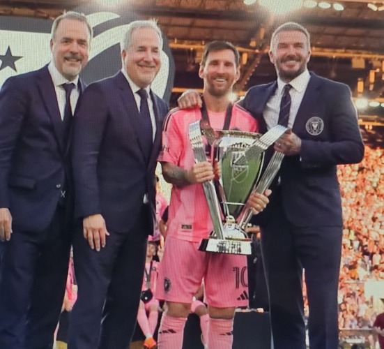 Lionel Messi celebrates Inter Miami's MLS Cup championship with owners David Beckham and Jorge and Jose Mas.