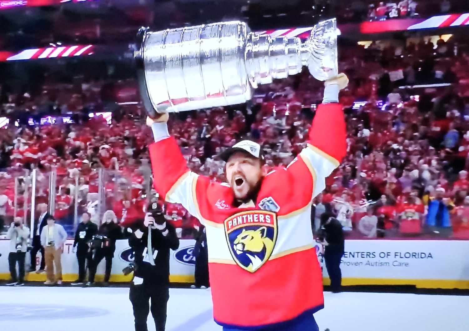 Sam Reinhart celebrates with the Stanley Cup after scoring four goals in the decisive victory for the Panthers.