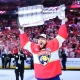 Sam Reinhart celebrates with the Stanley Cup after scoring four goals in the decisive victory for the Panthers.
