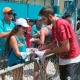 Josh Rosen signs autographs for fans following the first workout of Dolphins training camp on Thursday. (Craig Davis)