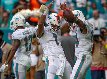 Miami Dolphins Tua Tagovailoa and Trent Sherfield dance in celebration of a touchdown against the Browns.