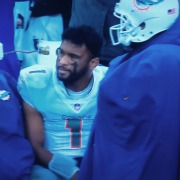 A frustrated Tua Tagovailoa on the sideline near the end of the Dolphins' 34-3 loss against the Titans.