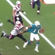 Tua Tagovailoa scrambles for the first of two touchdowns in a 22-12 Dolphins win over the Patriots.