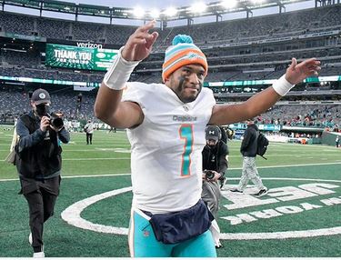 Tua Tagovailoa celebrates after the Miami Dolphins defeated the New York Jets 24-17.