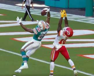The Dolphins' Xavien Howard makes a one-handed grab for his ninth interception of the season.